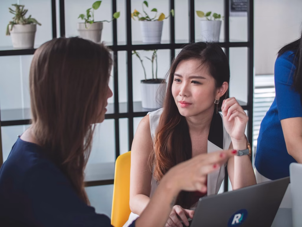Business owner discussing with SEO Specialist